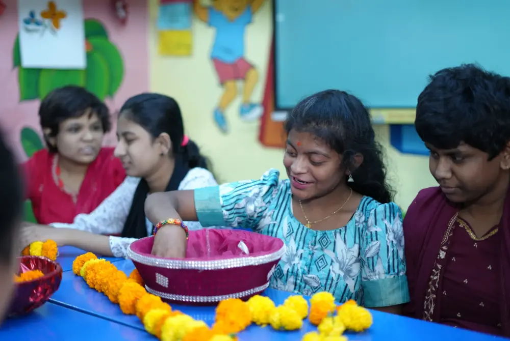 student picking flowers from bucket